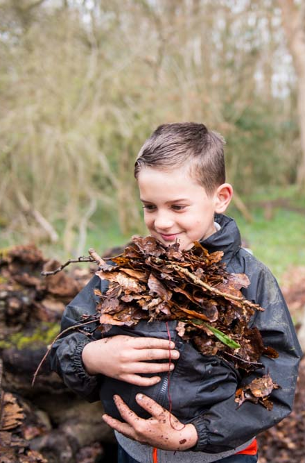 Hull Young person carrying leaves